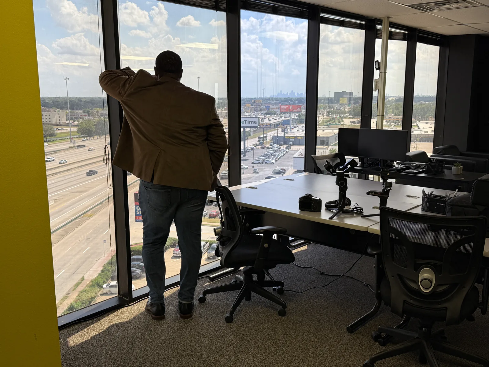 TJS Private Investigations office overlooking the Houston skyline